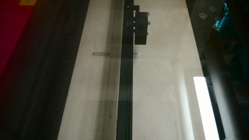 Laser-cut plywood panels laid out showing the box joint tab patterns