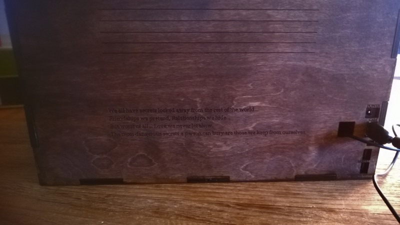 Back of stained box showing port labels showing through stain