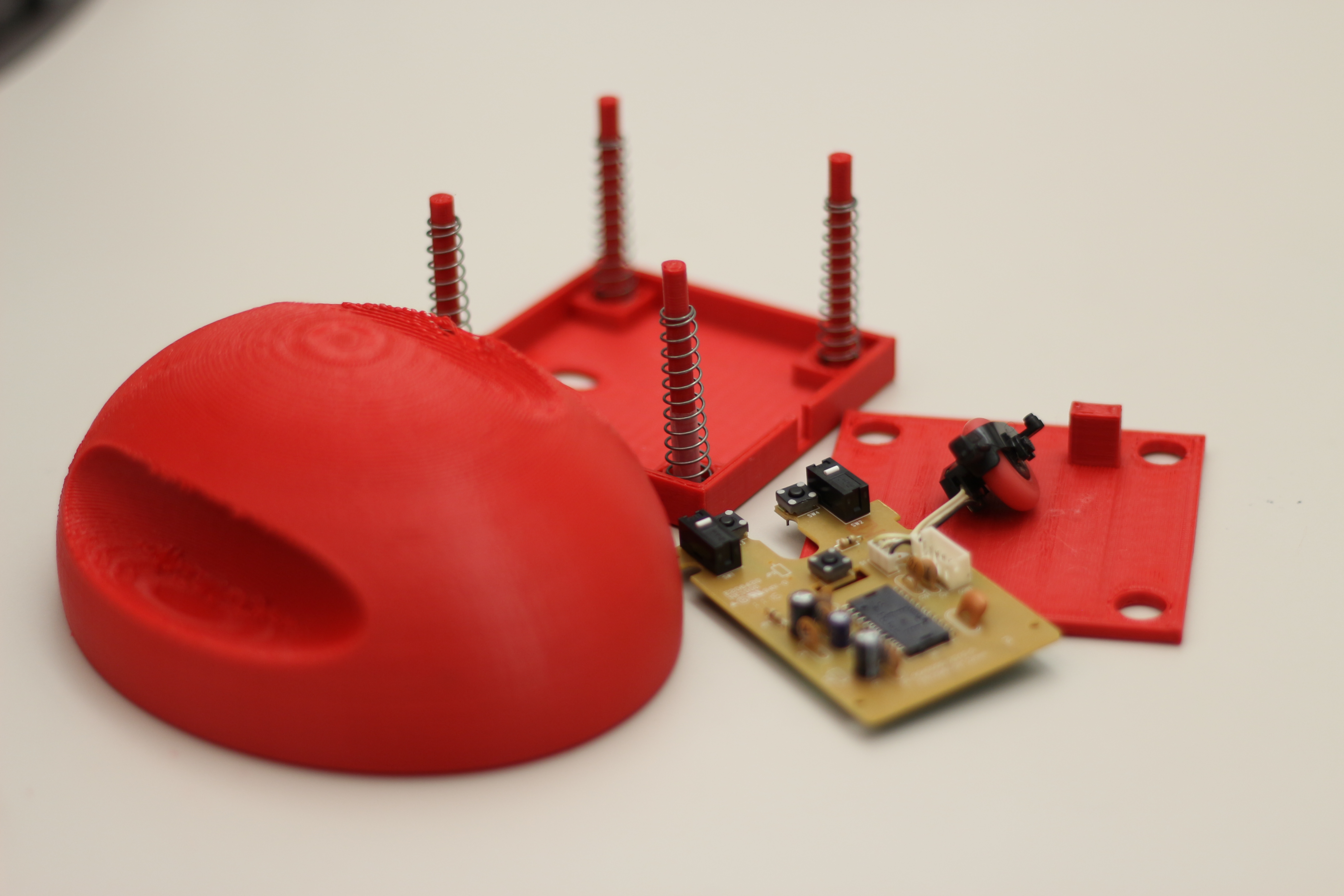 All 3D printed components laid out alongside the extracted circuit board