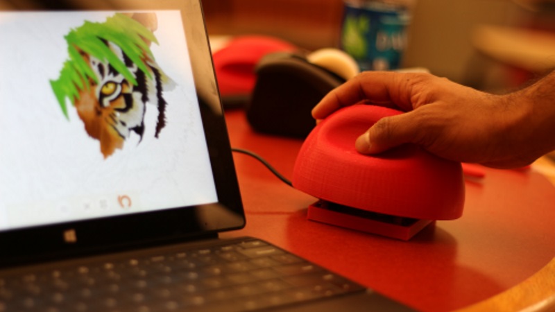 StampMouse assembled — a dome-shaped 3D printed mouse casing with no visible buttons