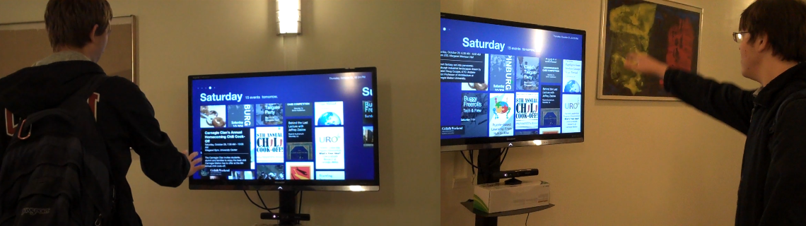 User interacting with Teudu's gesture-based event display in a campus hallway